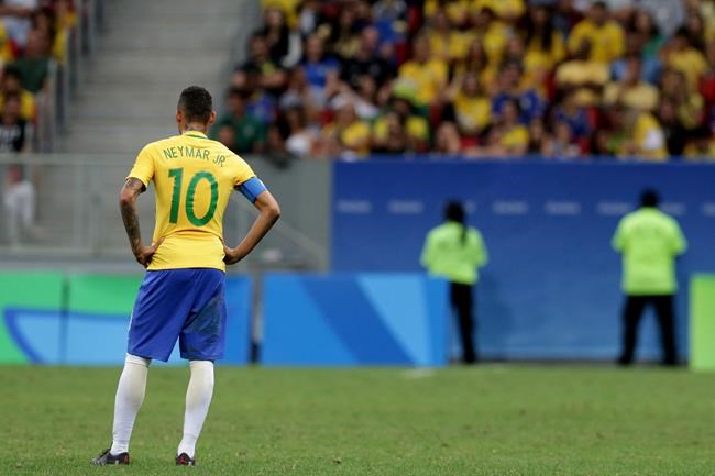 Brazil's Neymar stands on the field at the end of a group A match of the men's Olympic football tournament between Brazil and Iraq at the National Stadium in Brasilia Brazil Sunday Aug. 7 2016. The game ended in a 0-0 draw. (AP