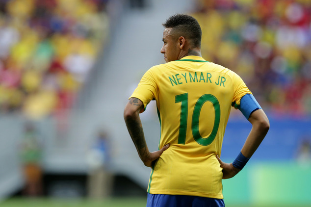 Brazil's Neymar stands on the field during a group A match of the men's Olympic football tournament between Brazil and South Africa at the National stadium