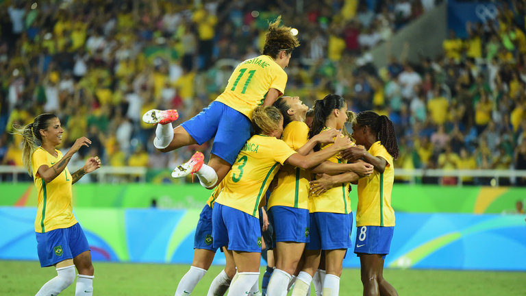 Brazil celebrate Marta's successful penalty