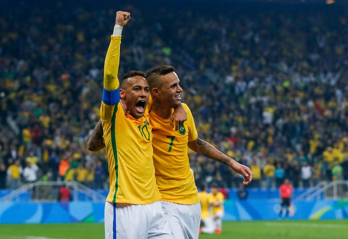 Brazil players Neymar and Luan celebrate their quarterfinals win over Colombia in the 2016 Rio Olympics