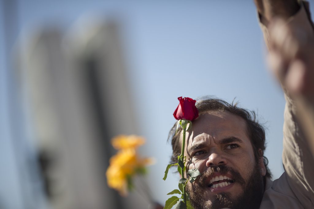 A demonstrator shouts slogans in support of Brazil's suspended President Dilma Rousseff on Monday in front of the National Congress where her impeachment trial is taking place