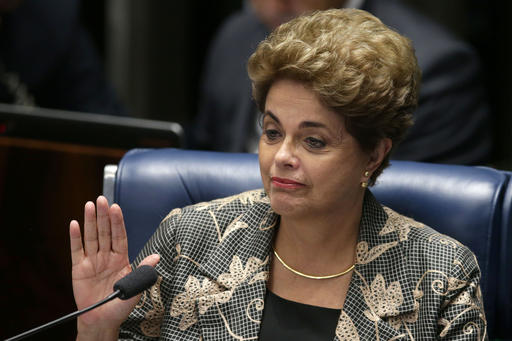 Suspended Brazilian President Dilma Rousseff waves goodbye after her impeachment trial at the Federal Senate in Brasilia Brazil Monday Aug. 29 2016. Rousseff's scheduled appearance during her impeachment trial is the culmination of a fight going