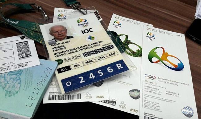 Documents belonging to Ireland's Patrick Hickey a member of the International Olympic Committee's executive board that include his Olympics&#39 credential and passport are displayed alongside Olympic tickets during a police press conference