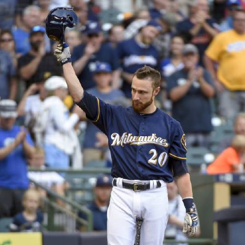 Jonathan Lucroy tips his cap after getting a standing ovation from fans while pinch-hitting during the eighth inning of a baseball game against the Pittsburgh Pirates on Sunday