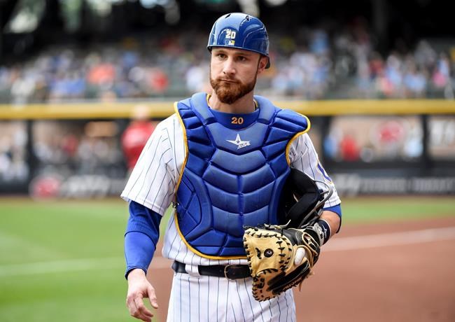 Milwaukee Brewers catcher Jonathan Lucroy gets ready before a baseball game against the Pittsburgh Pirates in Milwaukee. The AL West-leading Texas Rangers have acquired two-time All Star catcher Jonathan Lucroy and