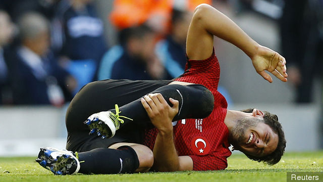 Turkey's Hakan Calhanoglu down injured