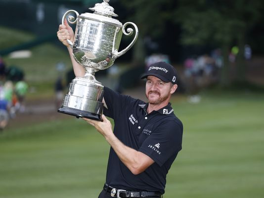 Brian Spurlock  USA TODAY Sports 
    Jimmy Walker hoists the 37-pound Wanamaker Trophy as PGA Champion