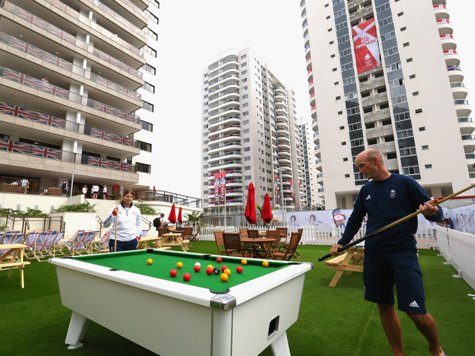 Athletes of Great Britain playing pool at the Olympic Village