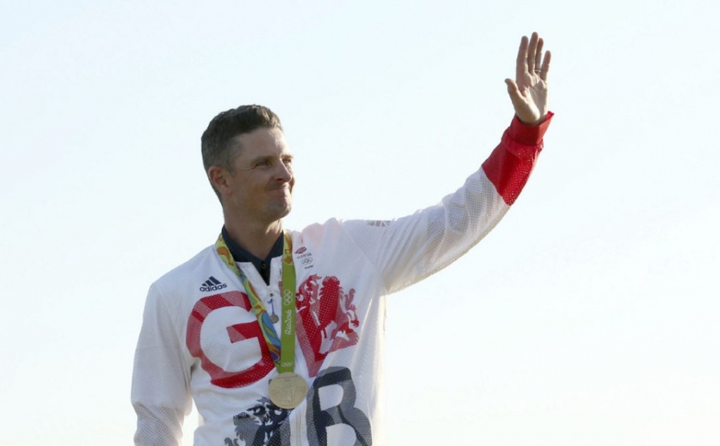 Justin Rose of Britain celebrates his gold medal win in the men's Olympic golf compeititon