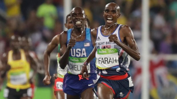 Britain's Mo Farah right and United States Paul Kipkemoi Chelimo second right compete in the men's 5000m final