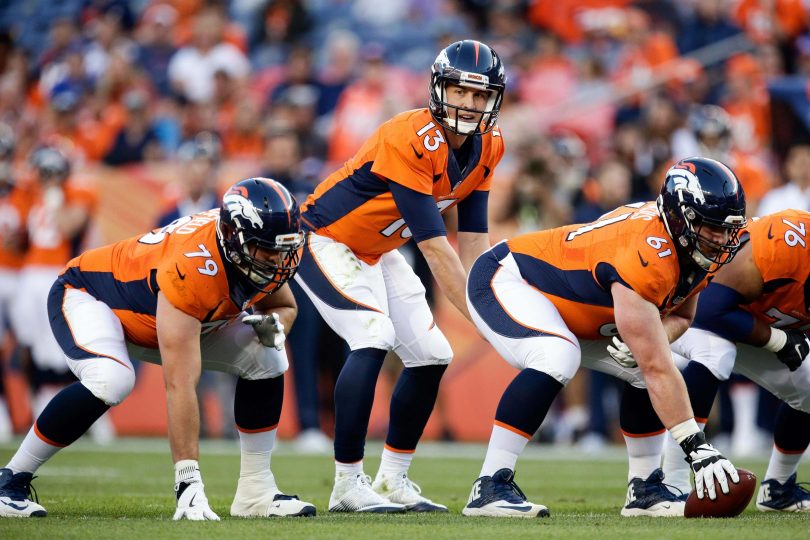 Aug 20 2016 Denver CO USA Denver Broncos quarterback Trevor Siemian looks over center Matt Paradis and tackle Michael Schofield at the line of scrimmage in the first quarter against the San Francisco 49ers at Sports Authority Field