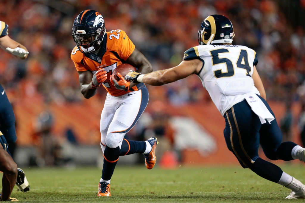 Aug 27 2016 Denver CO USA Denver Broncos running back Ronnie Hillman runs the ball against Los Angeles Rams inside linebacker Bryce Hager in the third quarter at Sports Authority Field at Mile High. The Broncos defeated the Rams 17-9. Manda