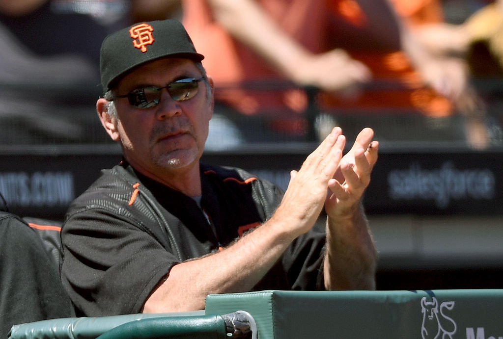 SAN FRANCISCO CA- JULY 31 Manager Bruce Bochy #15 of the San Francisco Giants celebrates clapping his hands after the Giants scored a run against the Washington Nationals in the bottom of the fifth inning at AT&T Park