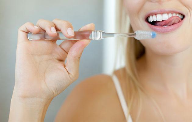 Brushing your teeth daily is still important to prevent plaque build