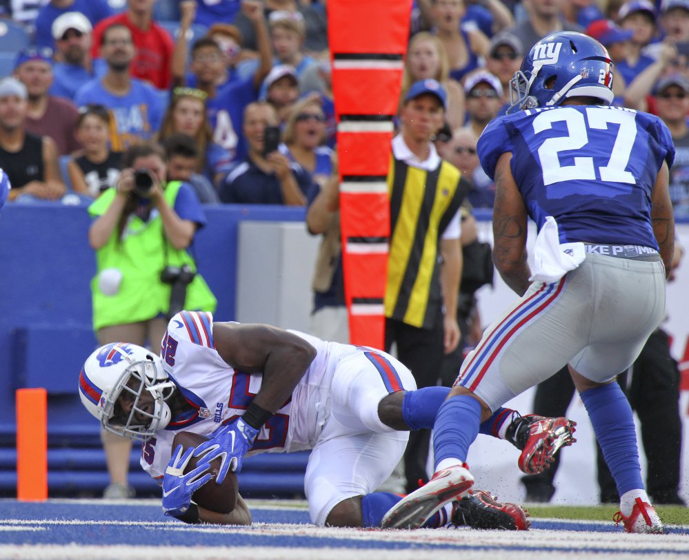 Buffalo running back Le Sean McCoy catches a touchdown pass against Giants safety Darian Thompson during the Bills 21-0 preseason win Saturday in Orchard Park N.Y