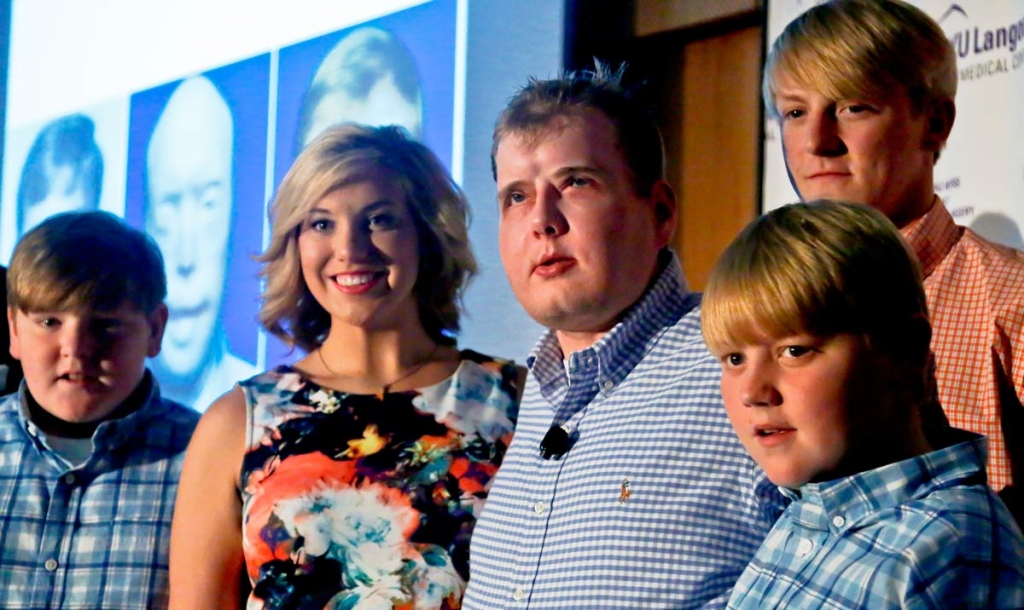 Former Mississippi firefighter Patrick Hardison 42 center is surrounded with his children Braden 13 far left Allison 21 second from left Cullen 12 far right and Dalton 18 second from right at a press conference marking one year after his