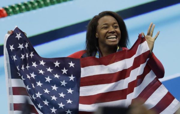 United States Simone Manuel celebrates winning the gold