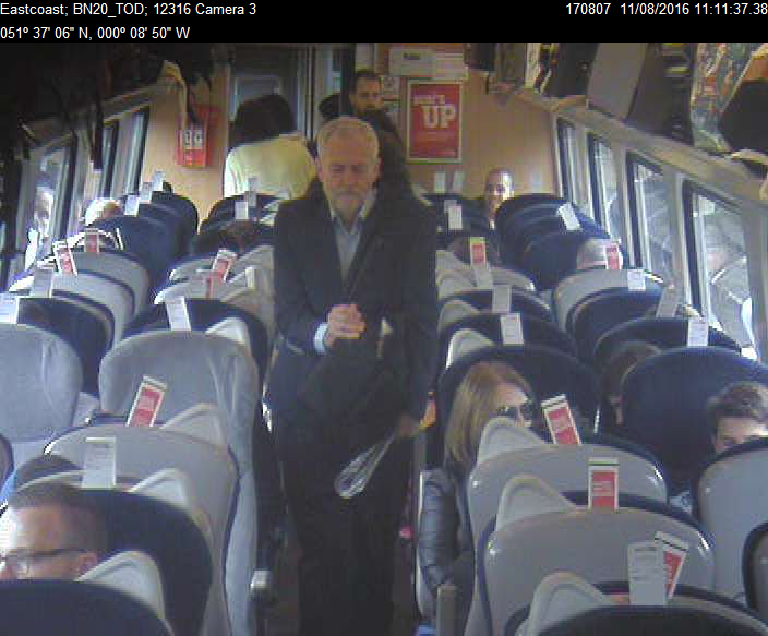 CCTV footage shows Mr Corbyn walking past reserved but empty seats at 11.08am in Coach F