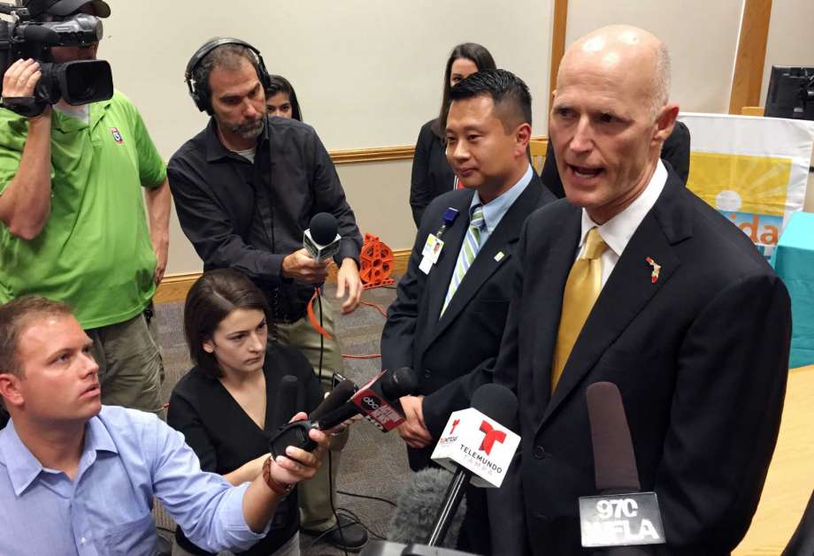 Florida Gov. Rick Scott addresses the media during a round-table discussion about the Zika virus in St. Petersburg Fla. Monday Aug. 1 2016. The CDC issued an advisory Monday Aug. 1 2016 that says pregnant women should not travel to the so-called Zi