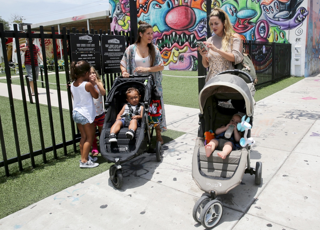 Vanessa Gomez with her son Ezra 2 and her friend Cristy Fernandez with her 9-month-old-son River in the Wynwood neighborhood of Miami. At least 14 people likely caught Zika from mosquitoes in the neighborhood health officials say. Gomez calls