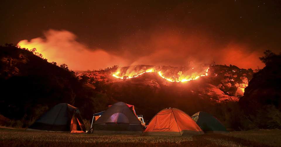 More than 2 dozen large wildfires burn in Western states