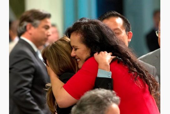 Assemblywoman Lorena Gonzalez D San Diego right receives congratulations from Assemblywoman Nora Campos D San Jose after the Assembly approved her bill requiring farmworkers to receive overtime pay after working eight hours at the Capitol Monday A