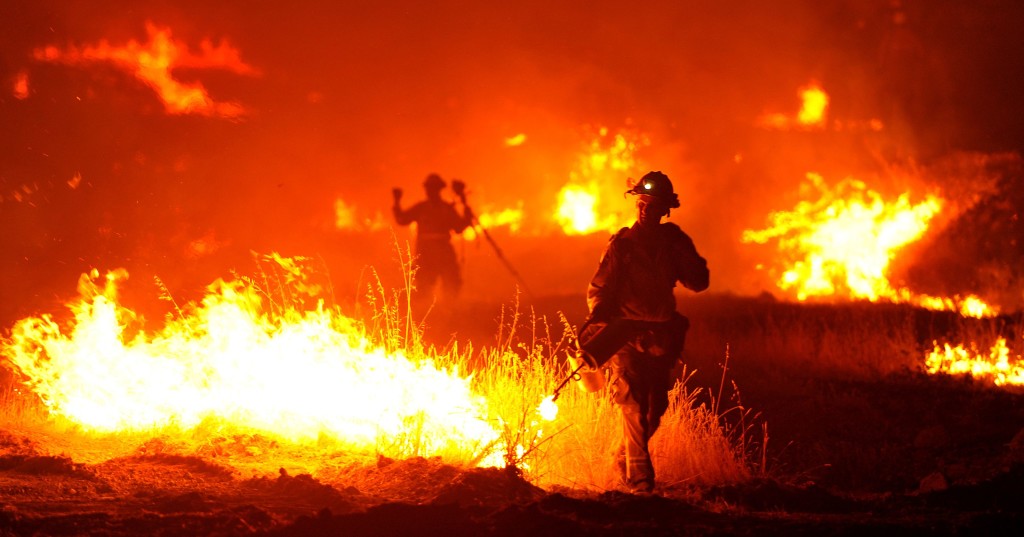 Wildfires burn in seven Western states