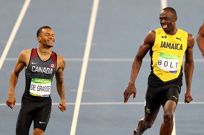 Canada's Andre De Grasse and Jamaica's Usain Bolt share a laugh yesterday at the end of their heat in Rio.   Getty Images