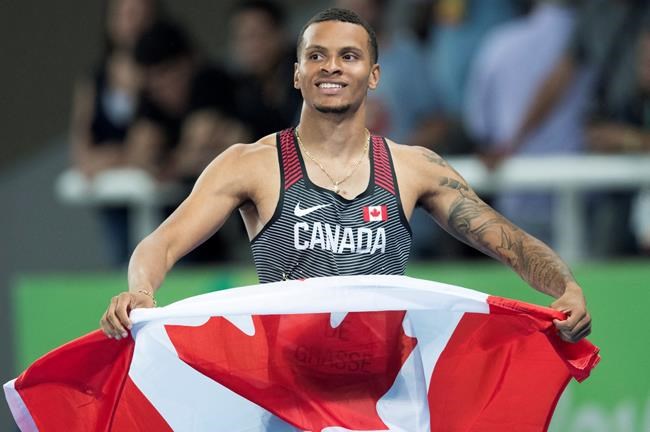 Canada's Andre De Grasse celebrates his silver medal performance in the 200-metre race at the Olympic games in Rio de Janeiro Brazil Thursday