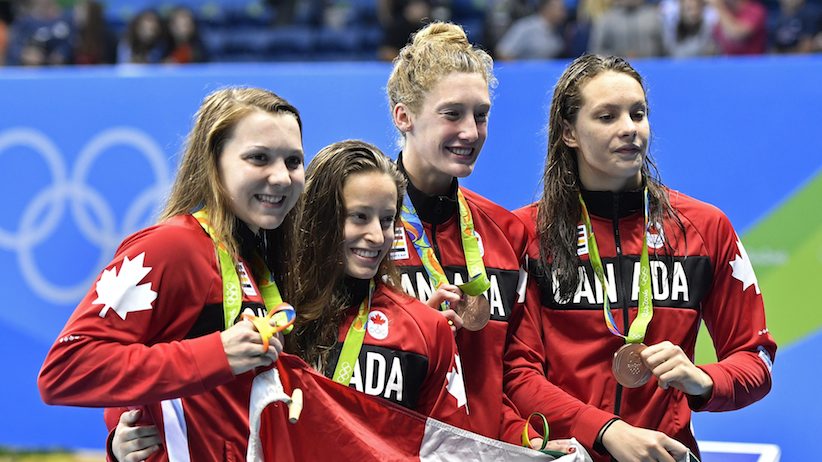 Canada's Brittany Maclean Katerine Savard Taylor Ruck and Penny Oleksiak from left hold up their bronze medals during the women's 4 x 200-meter freestyle relay medals ceremony during the swimming competitions at the 2016 Summer Olympics Thu