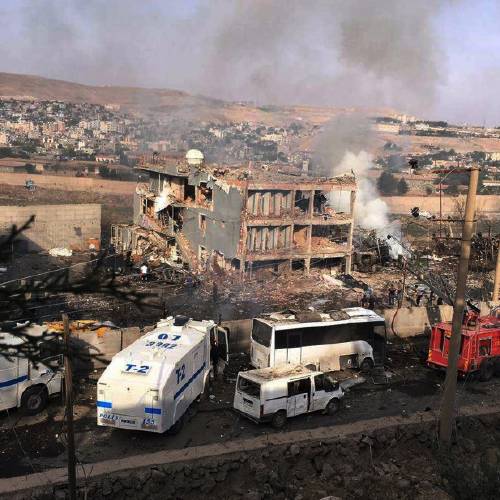 Smoke rises from buildings at the site of a car bomb explosion at a police headquarters in Cizre located in Turkey's Sirnak province bordering both Syria and Iraq in this still image from video