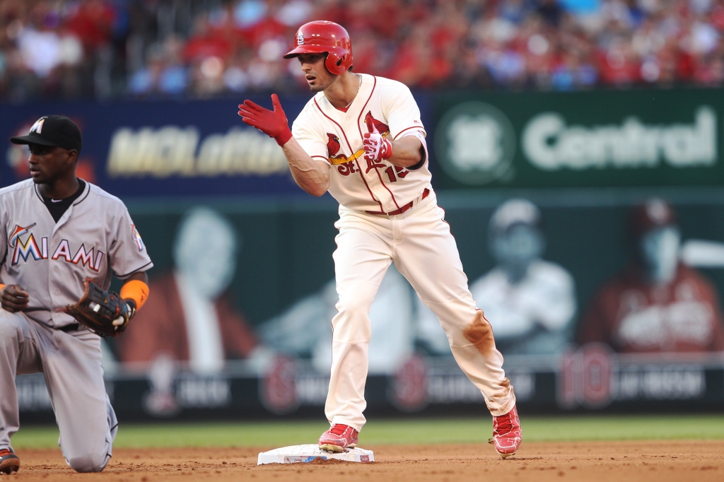 St. Louis Cardinals Randal Grichuk claps as he reaches second base with a RBI double in the fourth inning against the Miami Marlins at Busch Stadium in St. Louis