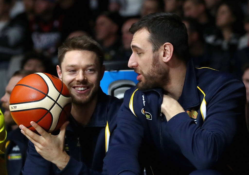 MELBOURNE AUSTRALIA- JULY 12 Matthew Dellavedova and Andrew Bogut of the Boomers chat on the bench during the match between the Australian Boomers and the Pac-12 College All Stars at Hisense Arena