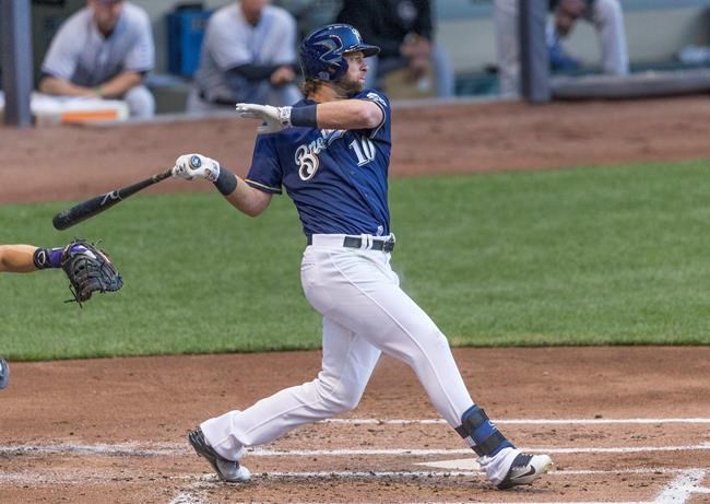 Milwaukee Brewers&#39 Kirk Nieuwenhuis hits a two RBI single off of Colorado Rockies&#39 Chad Bettis during the first inning of a baseball game Monday Aug. 22 2016 in Milwaukee