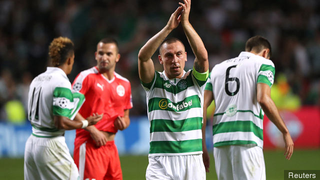 Celtic's Scott Brown applauds fans after the game