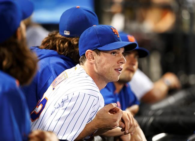 New York Mets starting pitcher Steven Matz who is on the disabled list watches a baseball game between the New York Mets and the Philadelphia Phillies from the dugout Saturday Aug. 27 2016 in New York