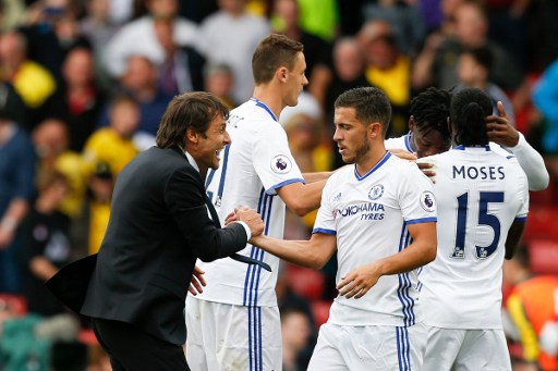 Chelsea's Italian head coach Antonio Conte shakes hands with Chelsea's Belgian midfielder Eden Hazard after the final whistle in the English Premier League football match between Watford and Chelsea at Vicarage Road Stadium in Watford