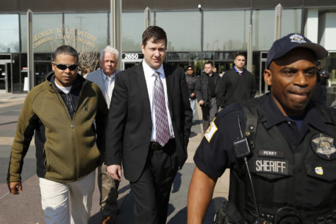 Officer Jason Van Dyke center leaves the Leighton Criminal Court Building in Chicago following a court appearance on May 5