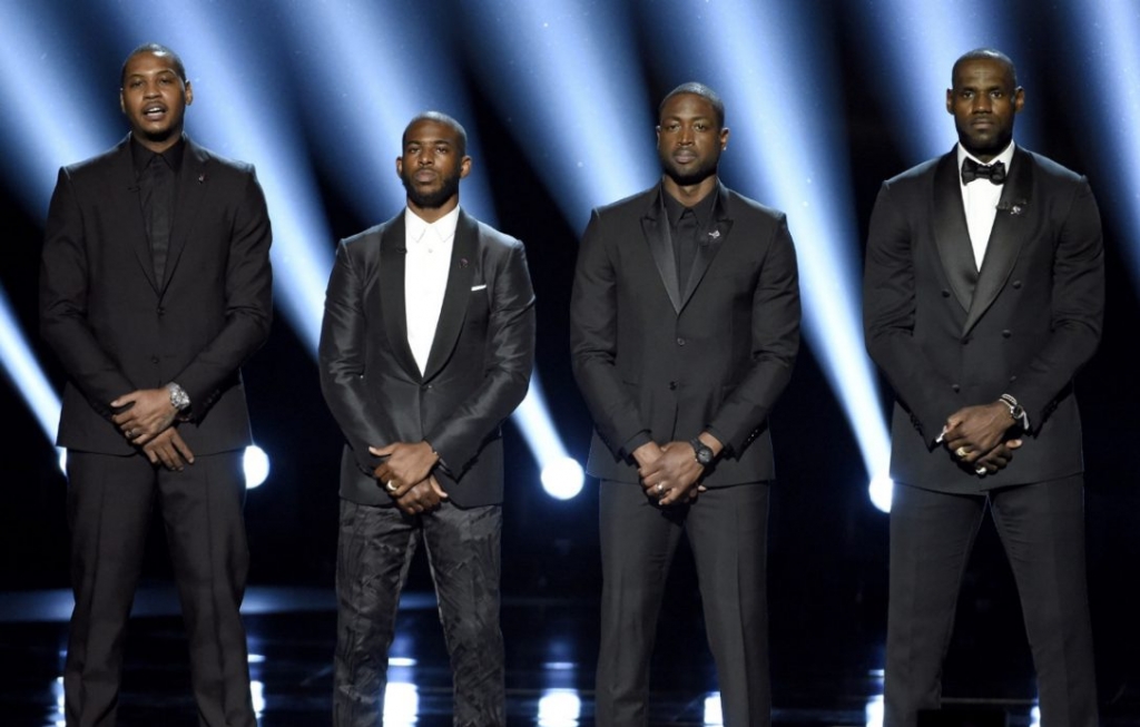 NBA basketball players Carmelo Anthony Chris Paul Dwyane Wade and Le Bron James from left speak on stage at the ESPY Awards in Los Angeles. The four gave an anti-violence speech and expressed their support of the values beh