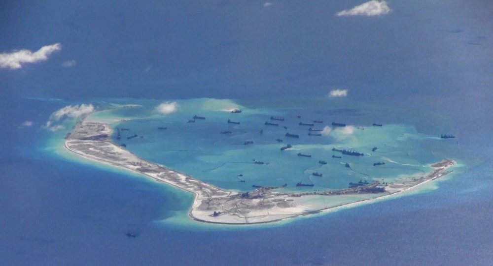 Chinese dredging vessels are purportedly seen in the waters around Mischief Reef in the disputed Spratly Islands in the South China