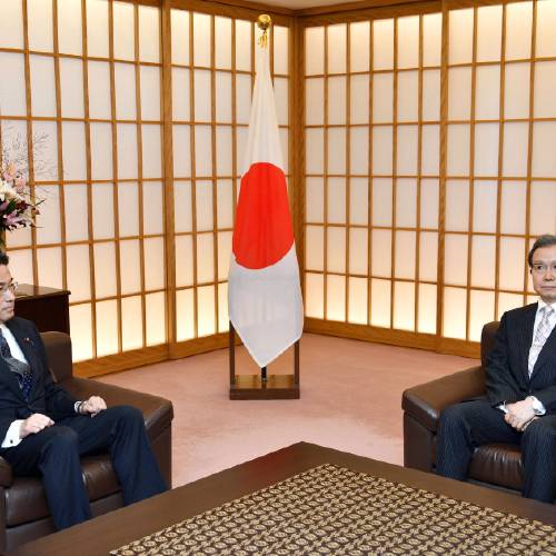 Minister Fumio Kishida left meets Chinese Ambassador to Japan Cheng Yonghua at foreign ministry in Tokyo Tuesday Aug. 9 2016. Kishida summoned China’s ambassador to his ministry lodging a protest over the increased number