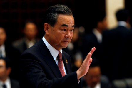 China's Foreign Minister Wang Yi arrives at a meeting at the sidelines of the ASEAN foreign ministers meeting in Vientiane Laos