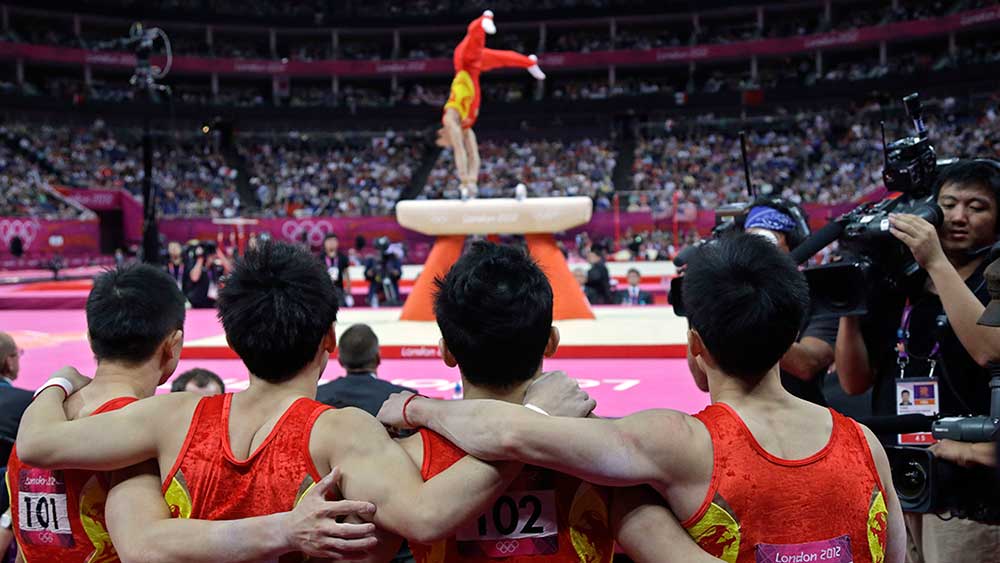 Chinese investors cheered a rising market along with their Olympic athletes