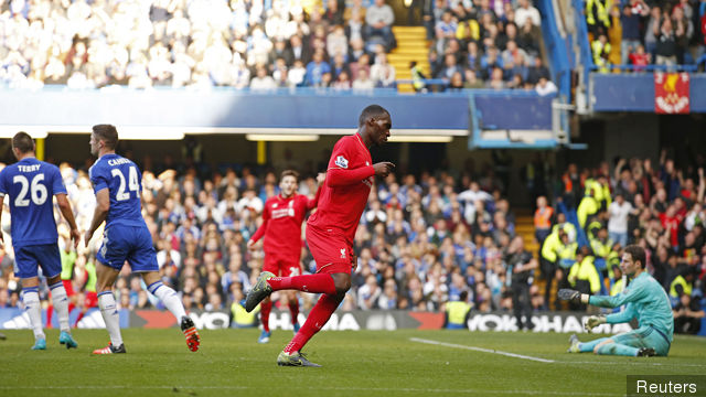 Christian Benteke celebrates after scoring the third goal for Liverpool