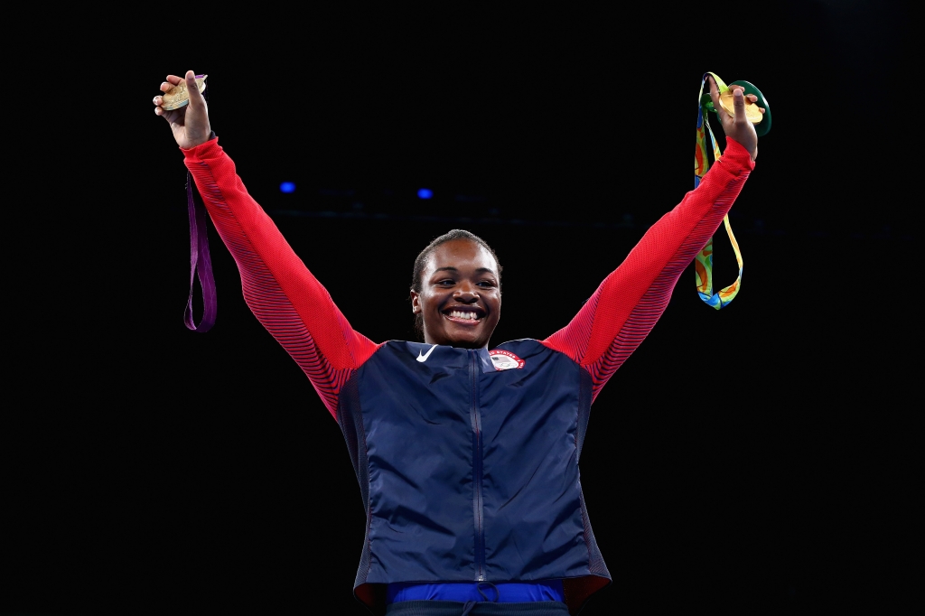 Gold medalist Claressa Maria Shields of the United States poses on the podium during the medal ceremony for the Women's Boxing Middle on Day 16 of the Rio 2016 Olympic Games at Riocentro- Pavilion 6