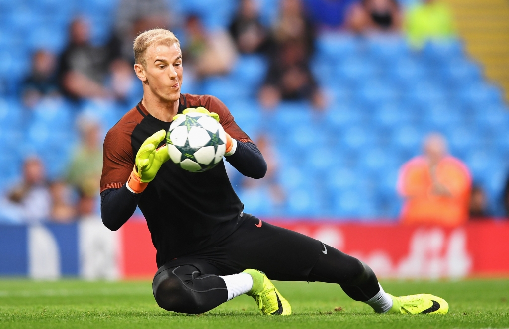 MANCHESTER ENGLAND- AUGUST 24 Joe Hart of Manchester City warms up prior to the UEFA Champions League Play-off Second Leg match between Manchester City and Steaua Bucharest at Etihad Stadium