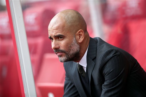 Manchester City Manager Pep Guardiola looks out before the match against Stoke City during their English Premier League soccer match at The Bet365 Stadium Stoke-on-Trent England Saturday Aug. 20 2016