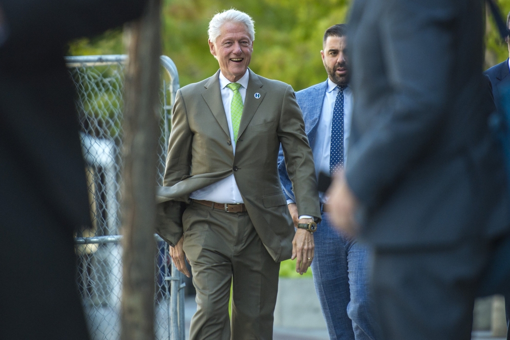 Former President Bill Clinton greets members of the public after participating in a meeting about economic issues with developer Kem Gardner in downtown Salt Lake City on Thursday Aug. 11 2016