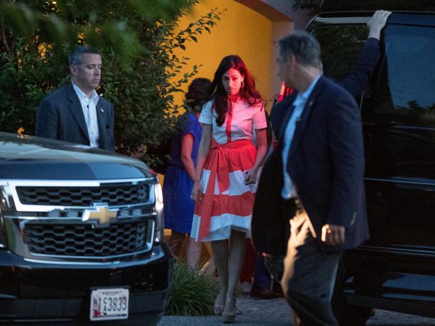 Democratic presidential candidate Hillary Clinton's senior aid Huma Abedin centre departs a fundraiser at a private home in Southampton New York on Sunday