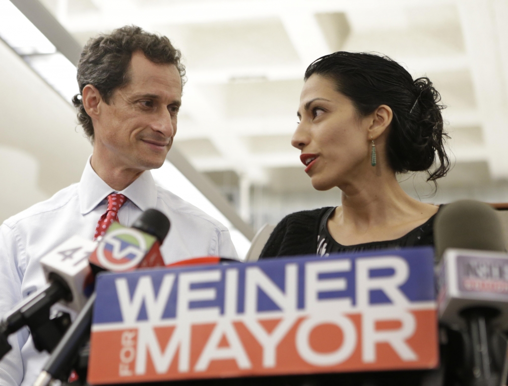 Huma Abedin alongside her husband then New York mayoral candidate Anthony Weiner speaks during a news conference in New York. Democratic presidential candidate Hillary Clinton aide Huma Abedin says she is separa